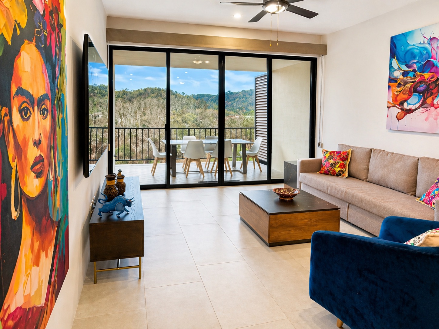 Frida wall, balcony with dining for 6, and lush jungle backdrop