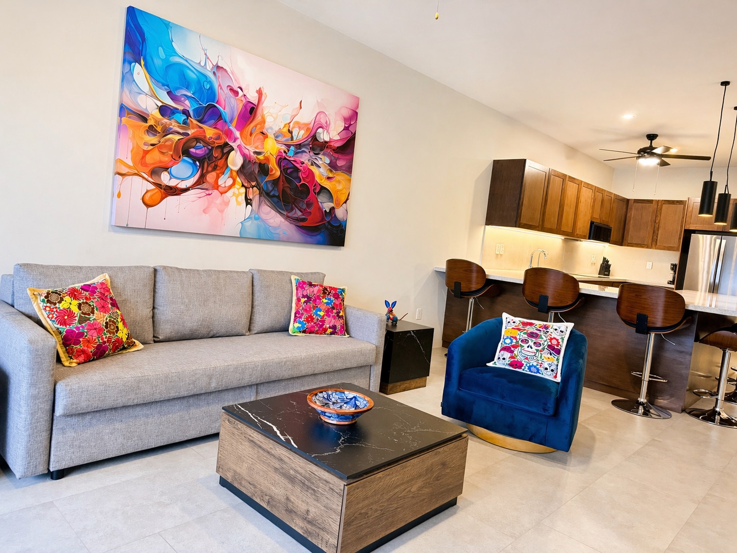 Open-concept living and kitchen — Mexican textiles meet modern finishes
