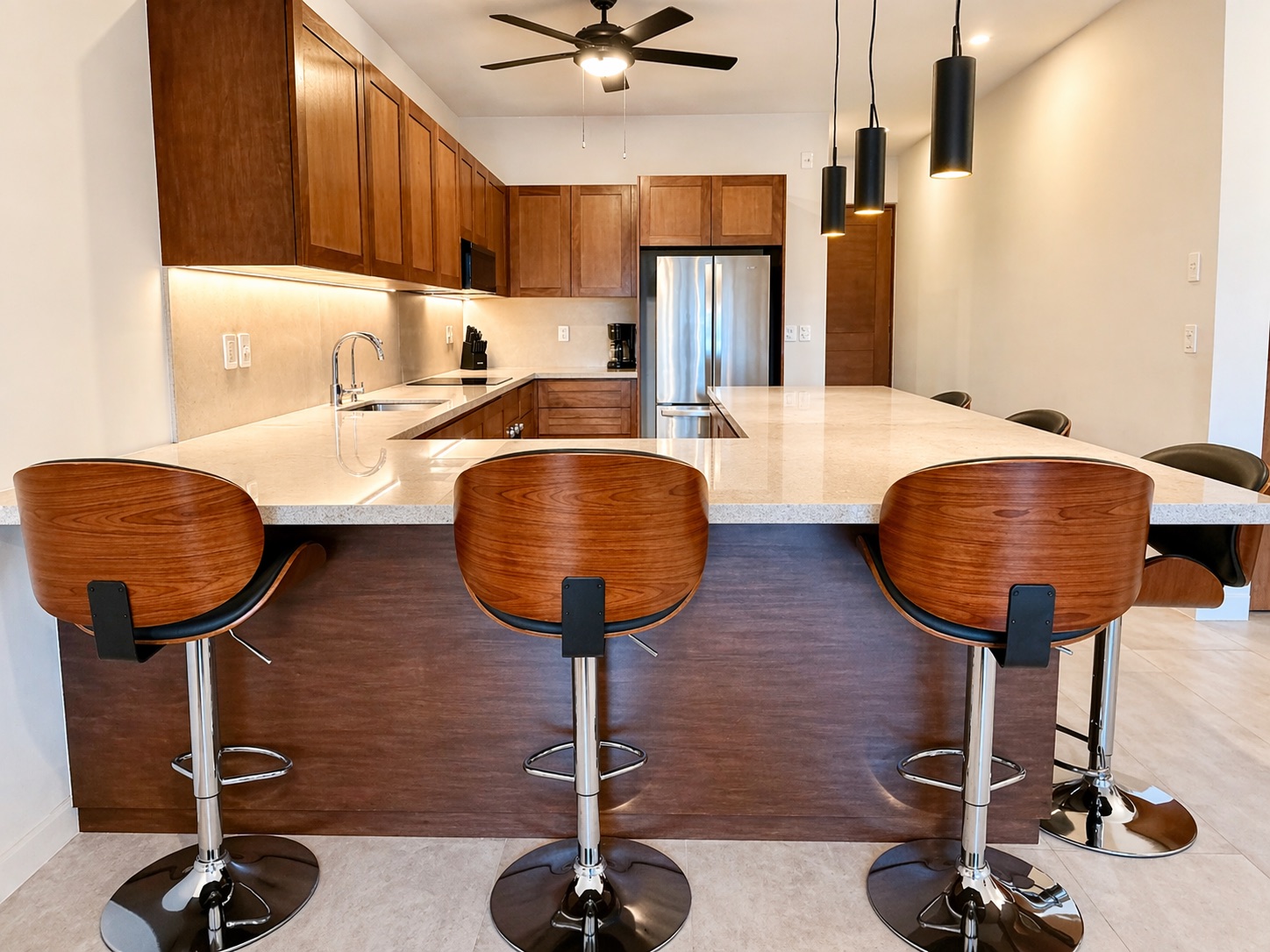 Bar seating, electric cooktop, and full pantry 